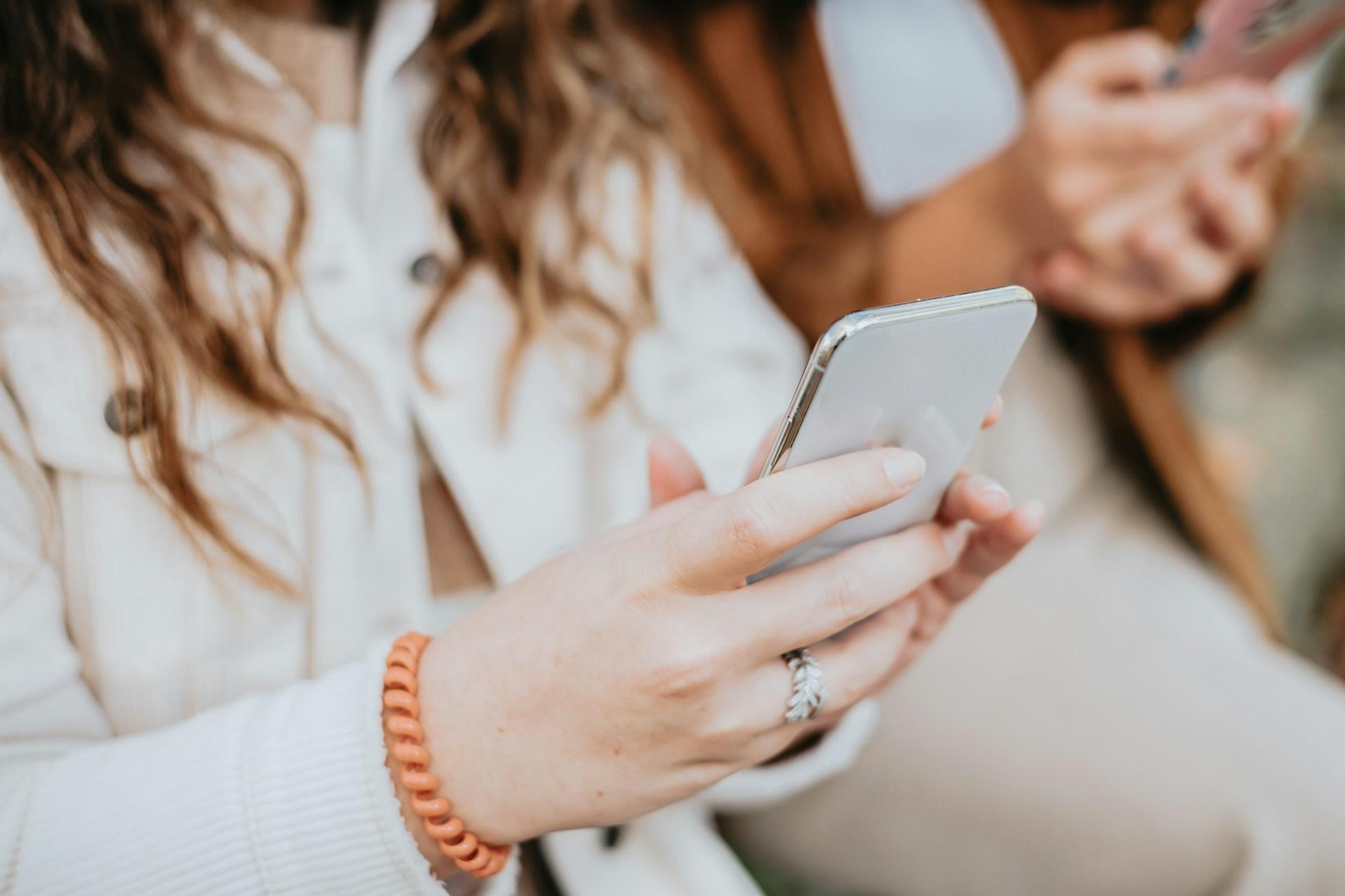 woman holding phone